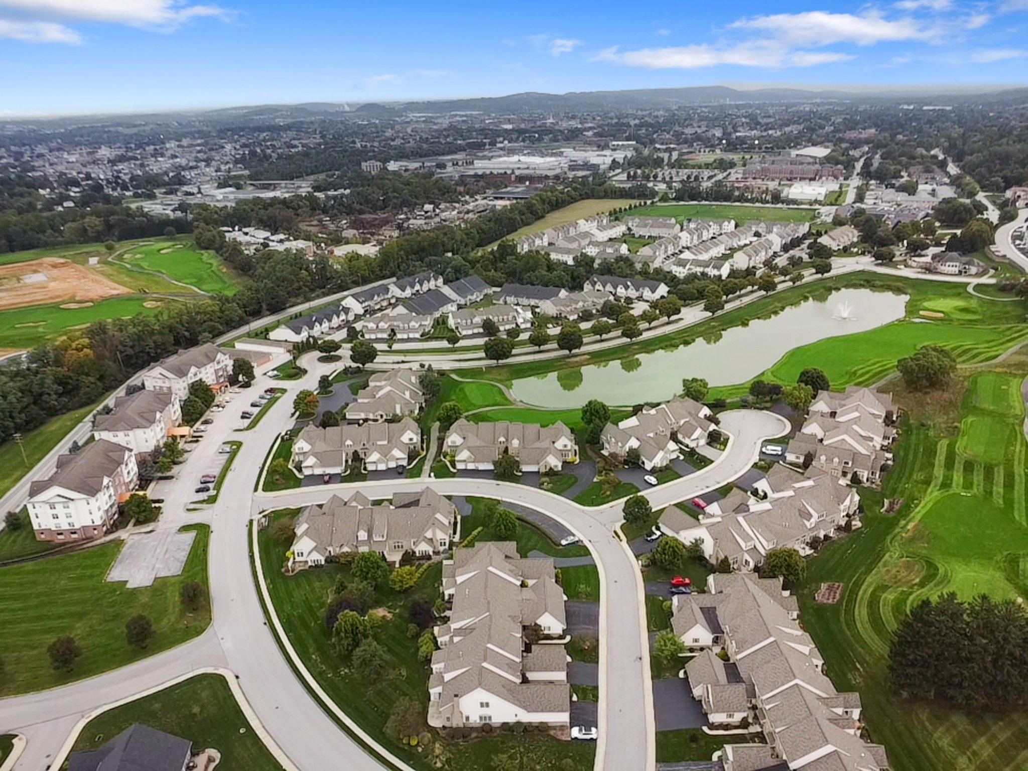 1010 Crest Way, Unit 103 York, PA 17403 - Photo 40 of 49 an aerial view of a swimming pool and mountain view in back