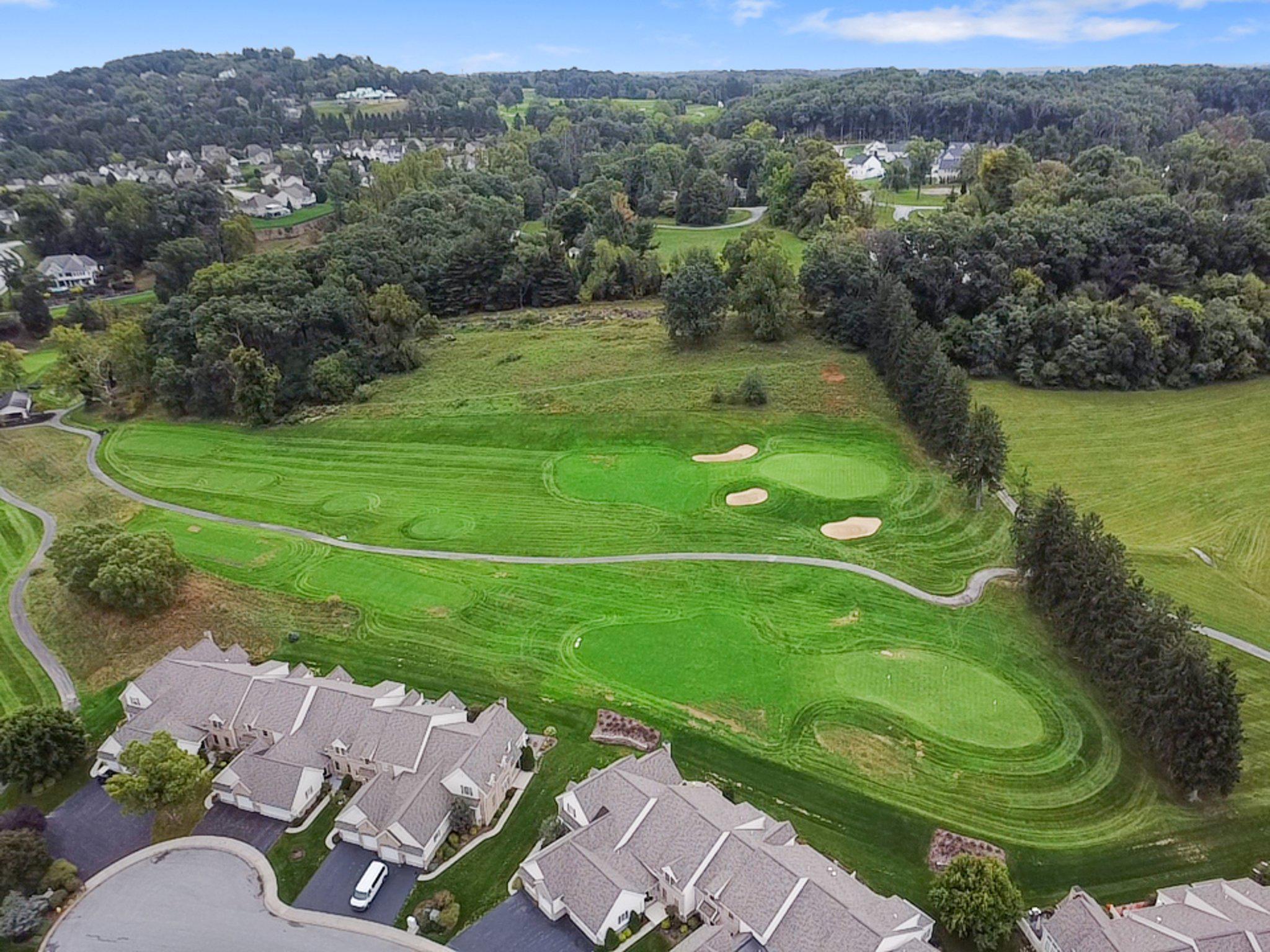 1010 Crest Way, Unit 103 York, PA 17403 - Photo 46 of 49 an aerial view of a golf course with huge green field