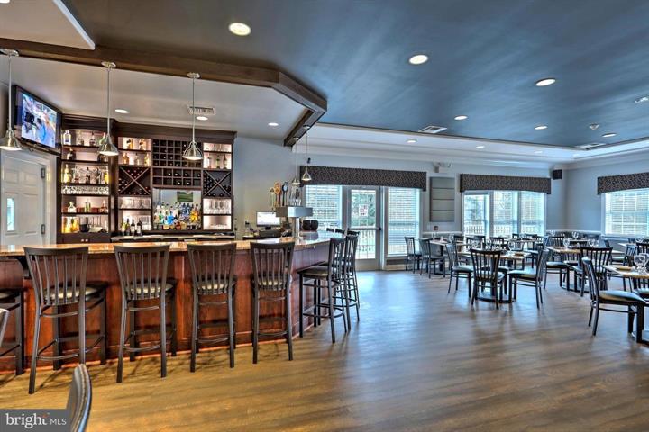 1010 Crest Way, Unit 103 York, PA 17403 - Photo 48 of 49 a dining room with lots of furniture and wooden floor