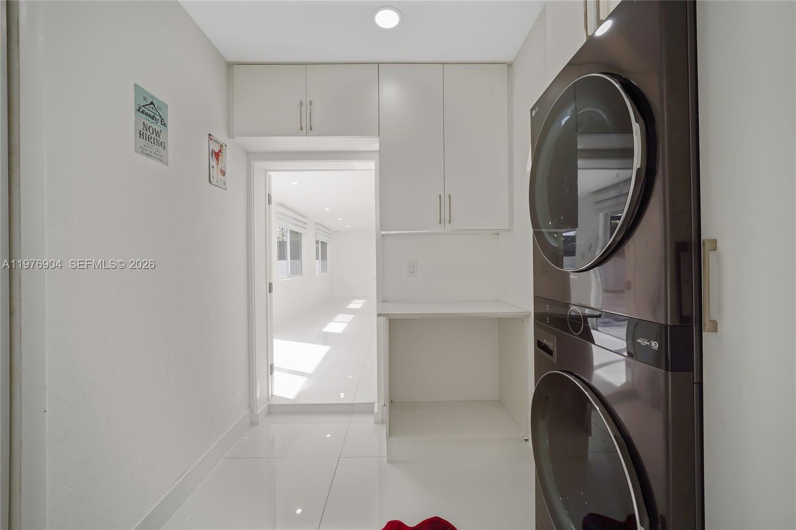 5635 West 13th Court Hialeah, FL 33012 - Photo 16 of 47 a view of a hallway with washer and dryer