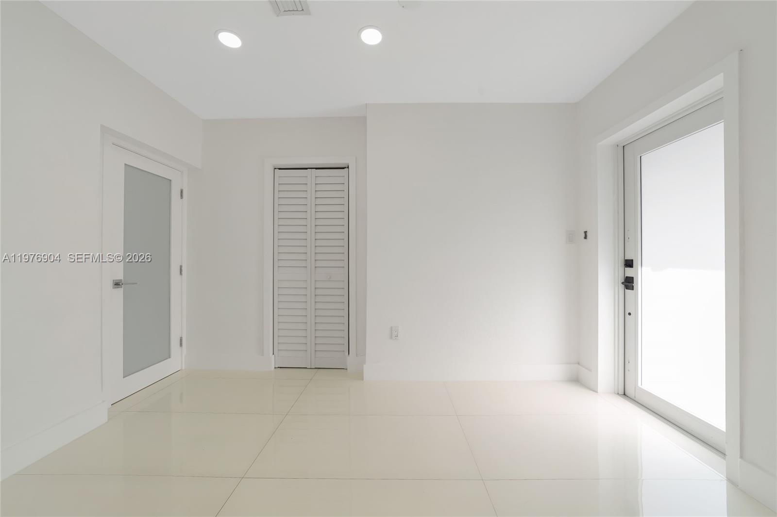 5635 West 13th Court Hialeah, FL 33012 - Photo 17 of 47 a view of an empty room
