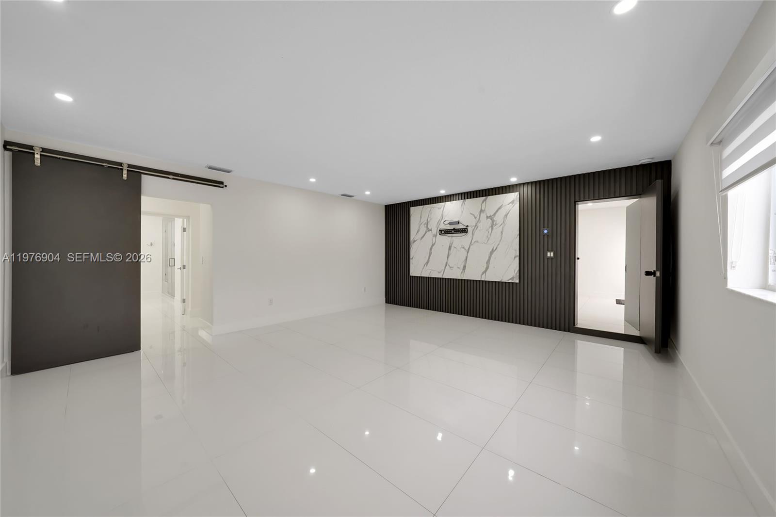 5635 West 13th Court Hialeah, FL 33012 - Photo 18 of 47 a view of an empty room