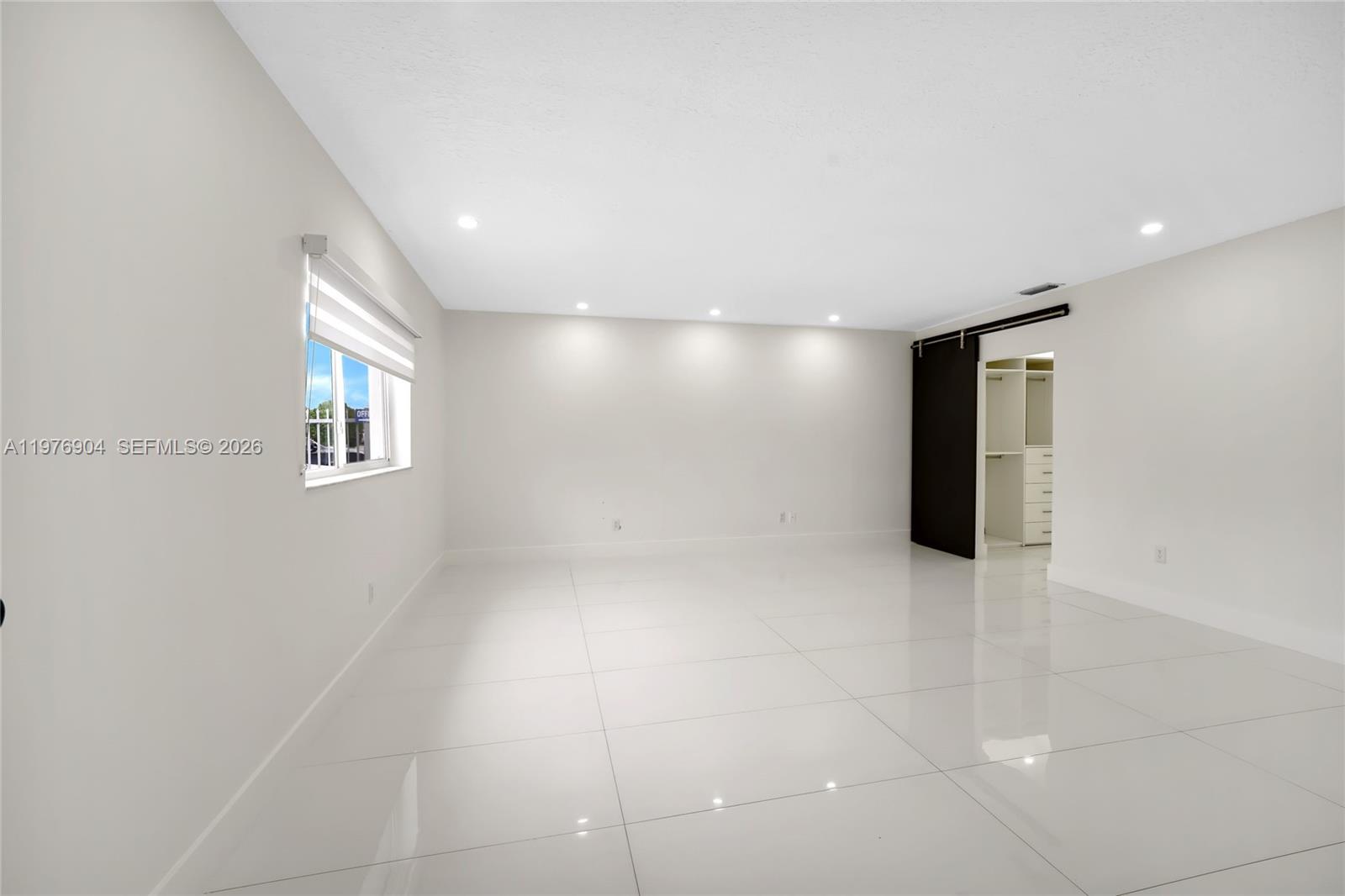 5635 West 13th Court Hialeah, FL 33012 - Photo 19 of 47 a view of an empty room