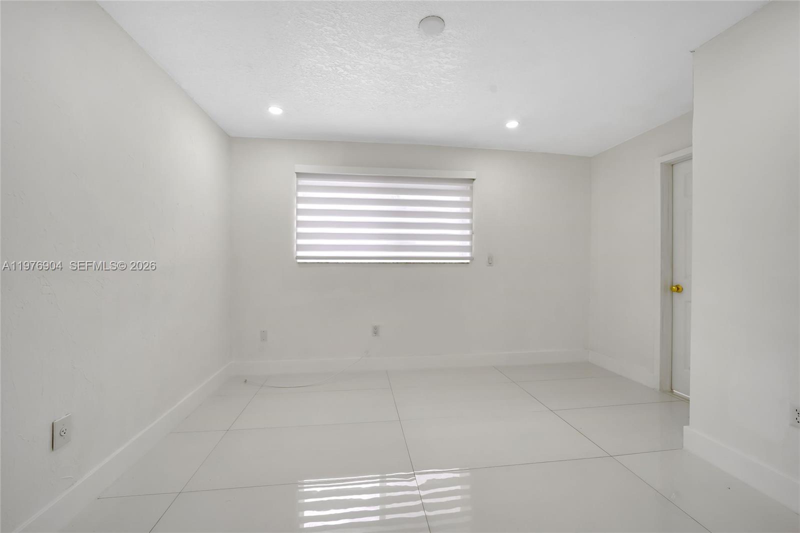 5635 West 13th Court Hialeah, FL 33012 - Photo 23 of 47 a view of room and window