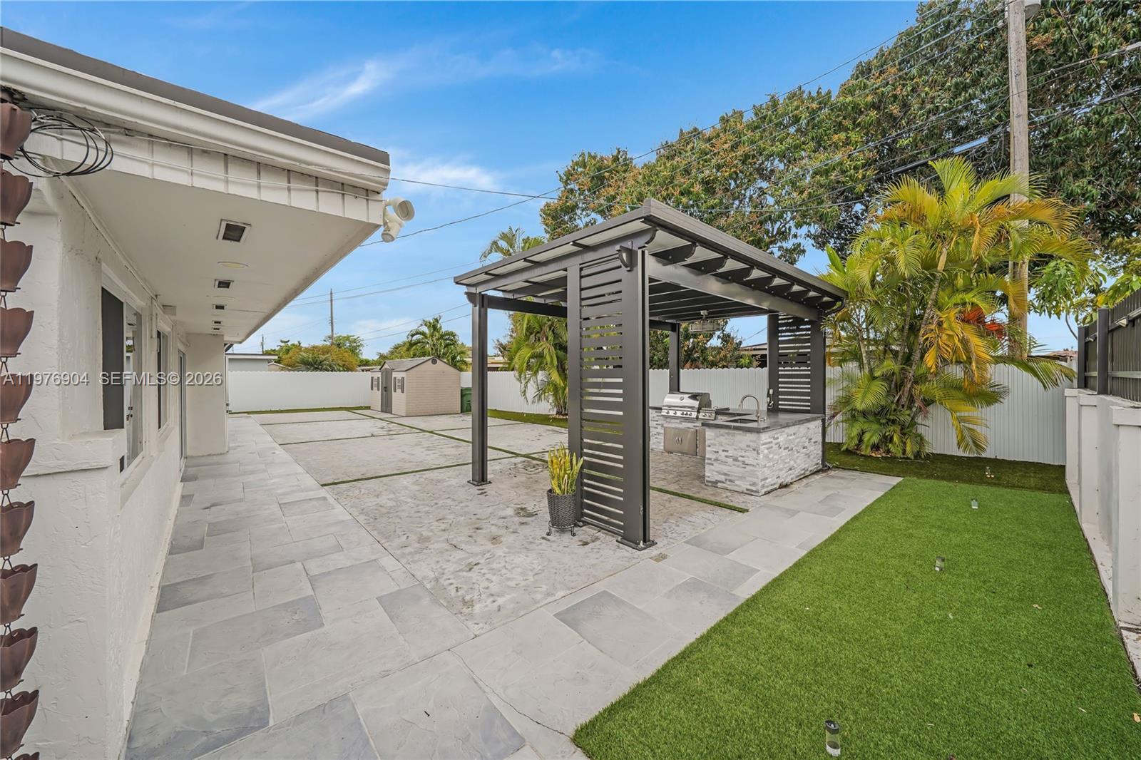 5635 West 13th Court Hialeah, FL 33012 - Photo 36 of 47 a view of a house with a yard