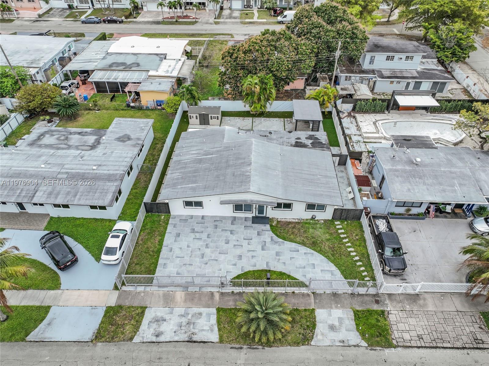5635 West 13th Court Hialeah, FL 33012 - Photo 43 of 47 an aerial view of a house with garden space and sitting area