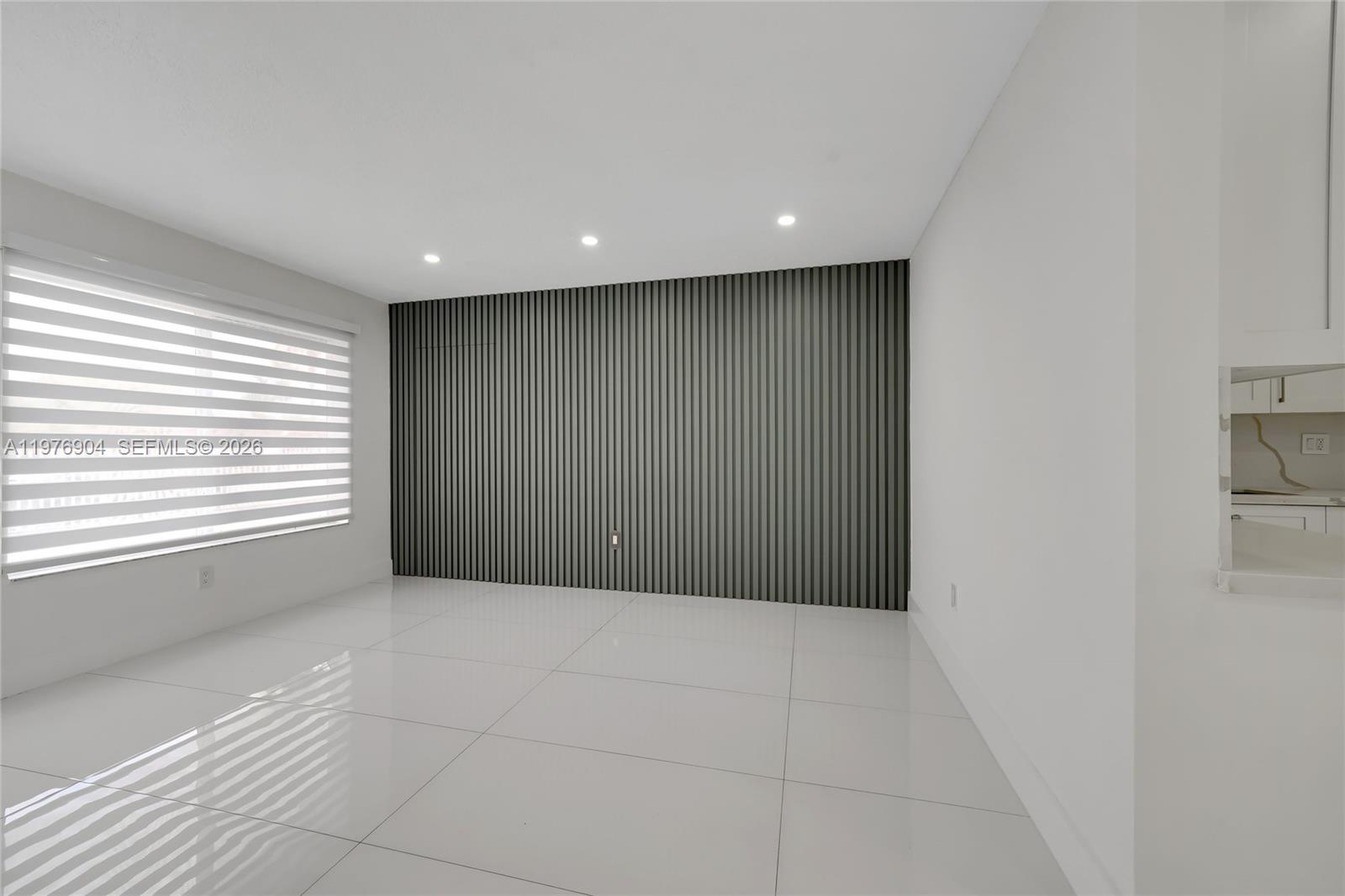 5635 West 13th Court Hialeah, FL 33012 - Photo 6 of 47 a view of an empty room with a window