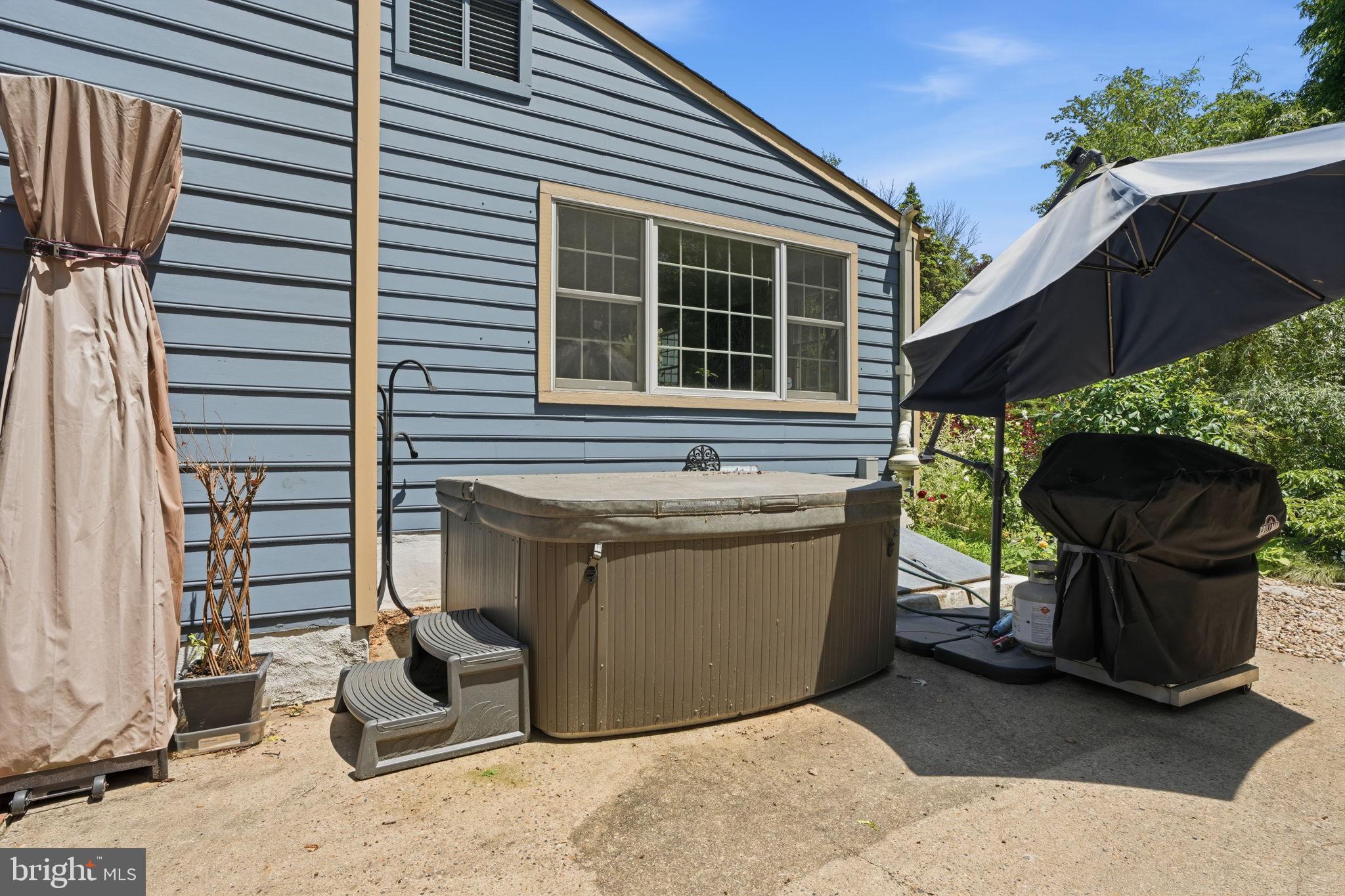 621 River Road Yardley, PA 19067 - Photo 53 of 75 a view of a chairs and table in the back yard of the house