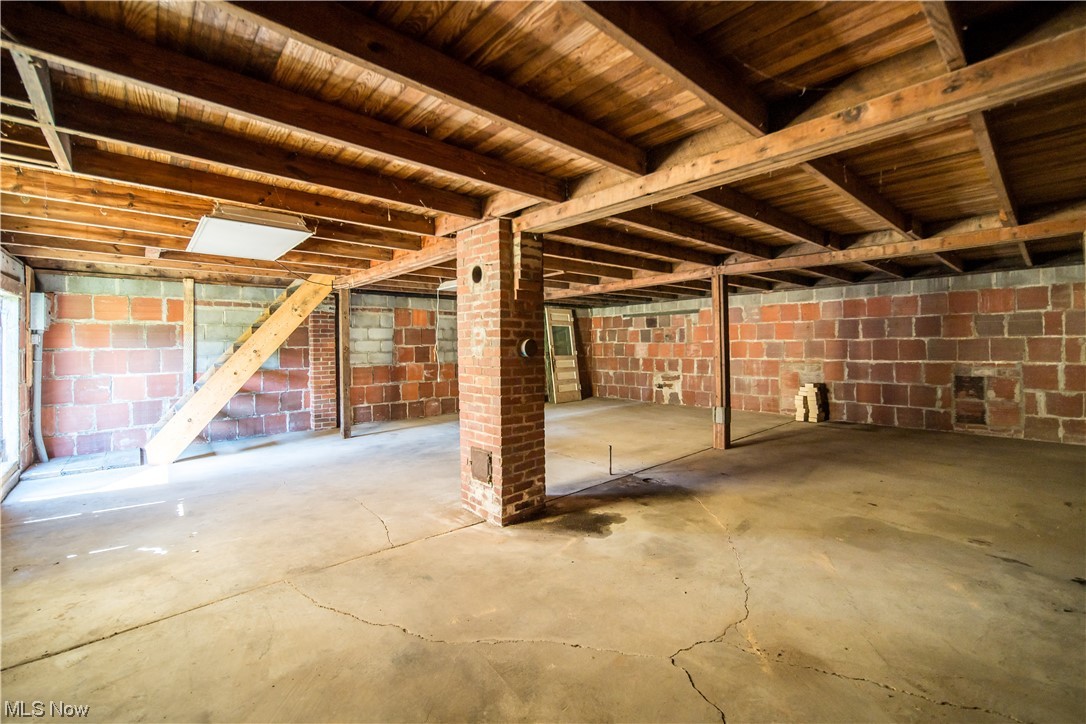 3023 Woodland Road Akron, OH 44312 - Photo 25 of 30 Basement with wood ceiling and brick wall