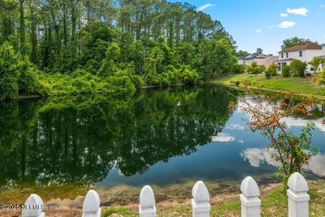a backyard of a house with lots of green space