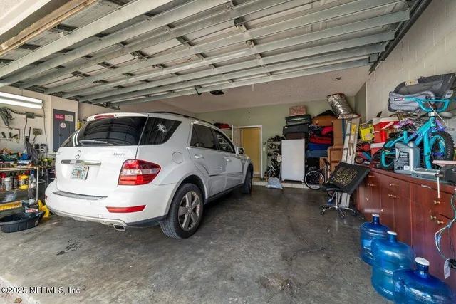 a view of a house with swimming pool and a yard