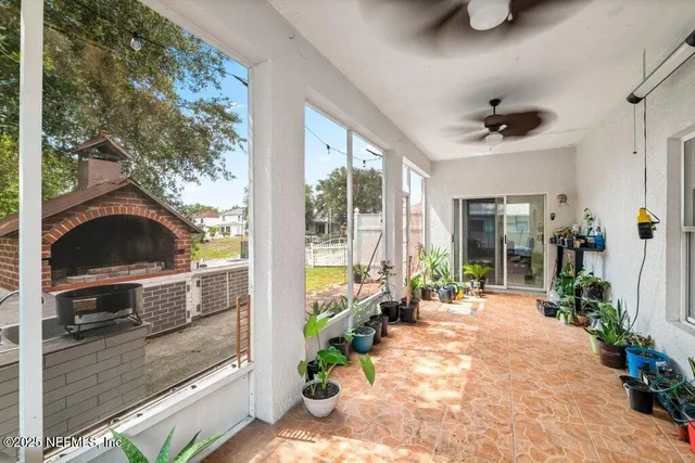 a view of a livingroom with wooden floor and stairs