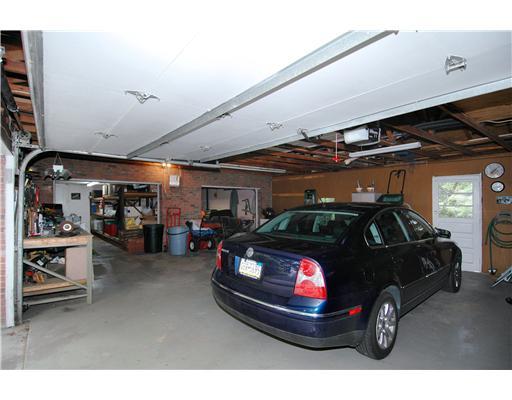216 Woodcroft Road Economy, PA 15005 - Photo 14 of 18 Parking Lot/Garage. Garage Interior - to the left is the original 2 car integral garage - a great place to work on cars or keep equipment. There is a double garage door on the attached garage and additional workspace.