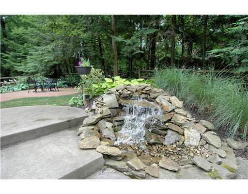216 Woodcroft Road Economy, PA 15005 - Photo 17 of 18 Yard/Garden. New Stone Waterfall and Brick Patio enhance the already Perfectly Lanscaped Yard