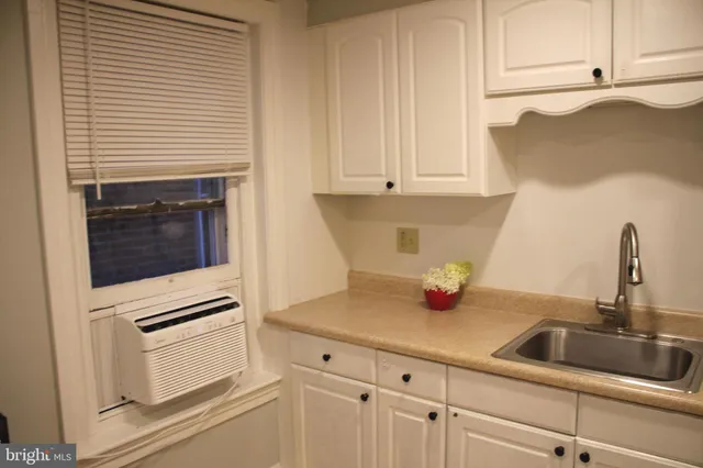 a bathroom with a toilet and a bathtub