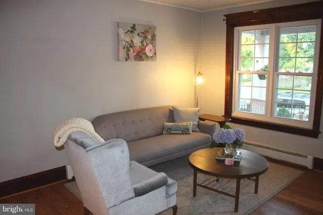 a table with a lamp and a window