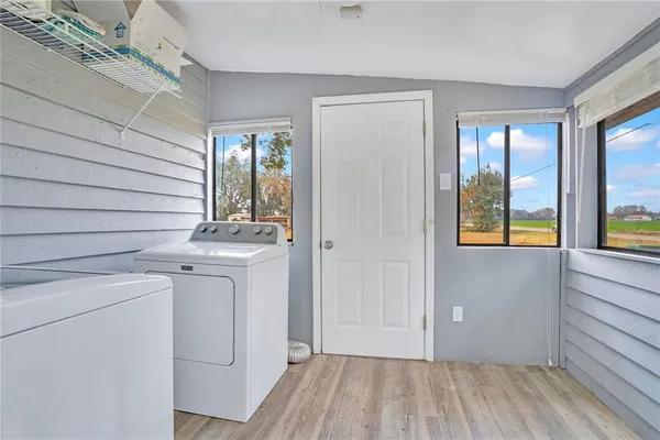 a view of hallway with washer and dryer