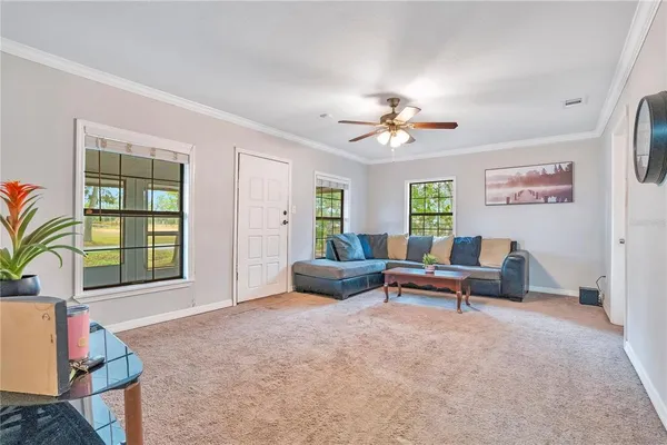 a living room with furniture and a window