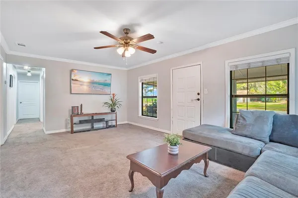 a living room with furniture and a window