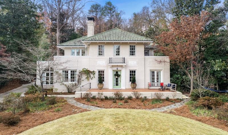 1156 Springdale Road Northeast Atlanta, GA 30306 - Photo 1 of 1 a front view of a house with a yard