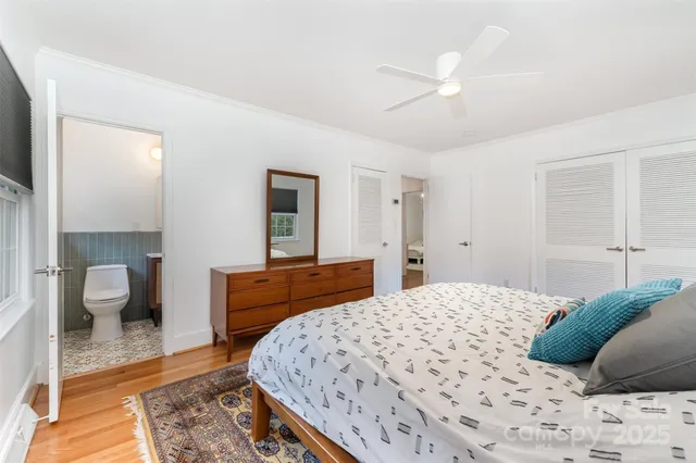 a bedroom with a large bed and a couch