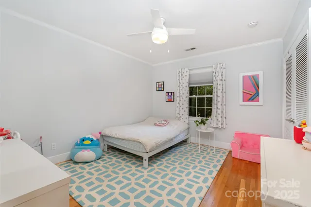 a bedroom with furniture and a window