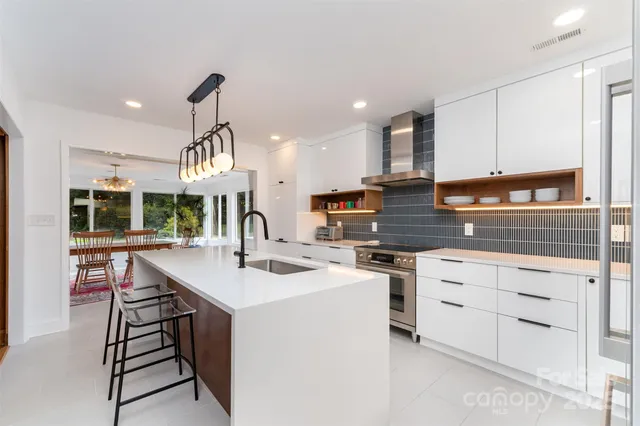 a kitchen with a sink stove and cabinets