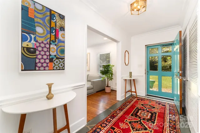 a living room with furniture and a rug