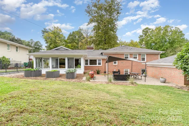 a view of a house with a yard porch and sitting area