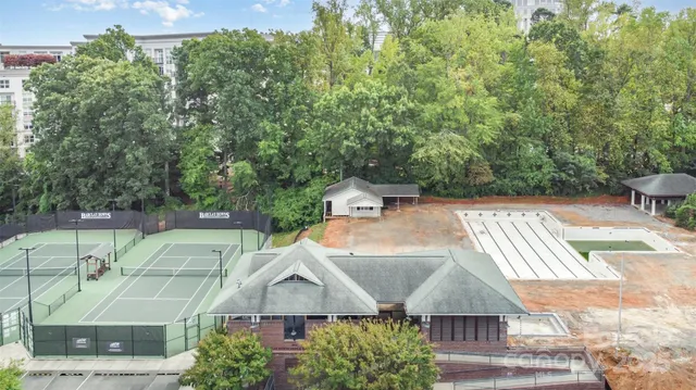 a aerial view of a house with a yard and sitting area