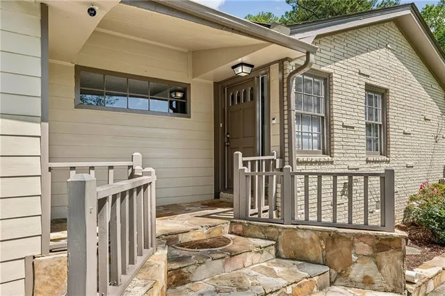 a front view of a house with wooden fence