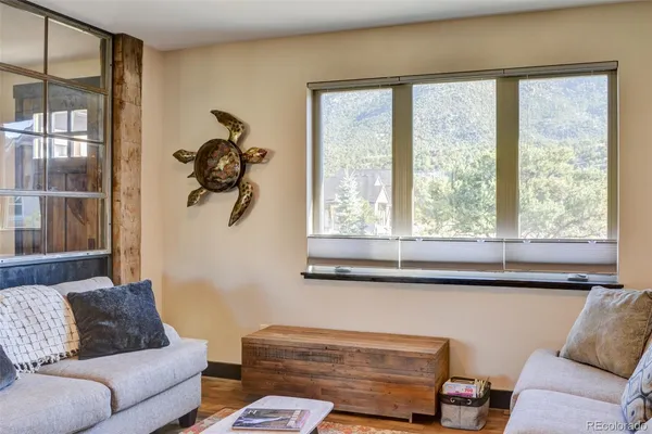 a living room with furniture and a window