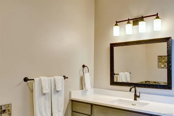 a bathroom with a sink and mirror