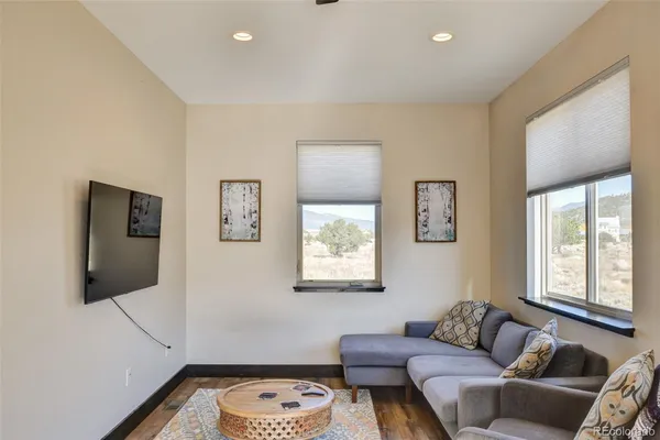 a living room with furniture and a window