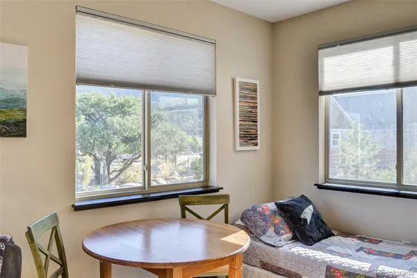 a view of a livingroom with furniture and window