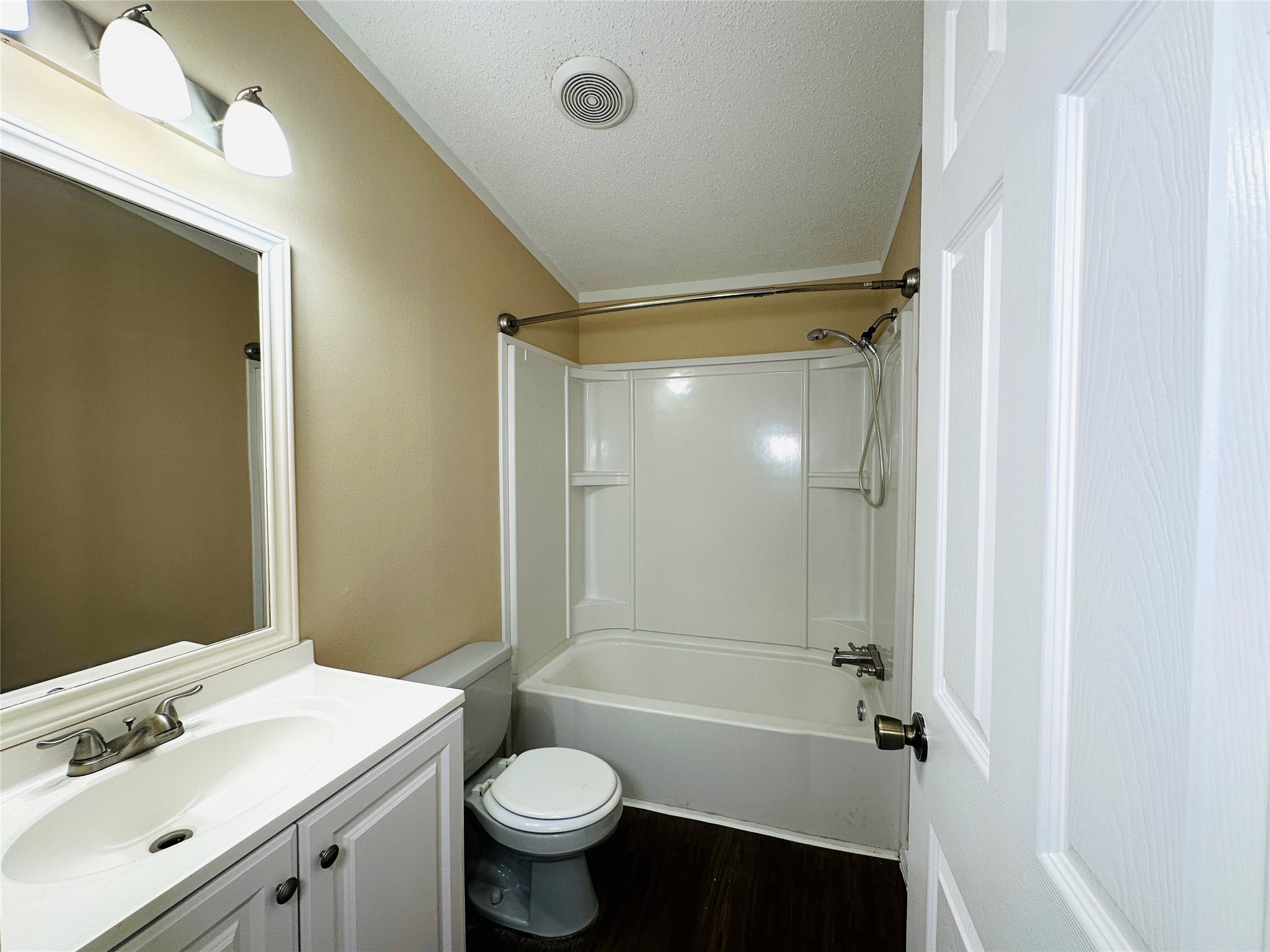16497 Spring Rain Court Conroe, TX 77302 - Photo 15 of 18 a bathroom with a sink mirror toilet and bathtub