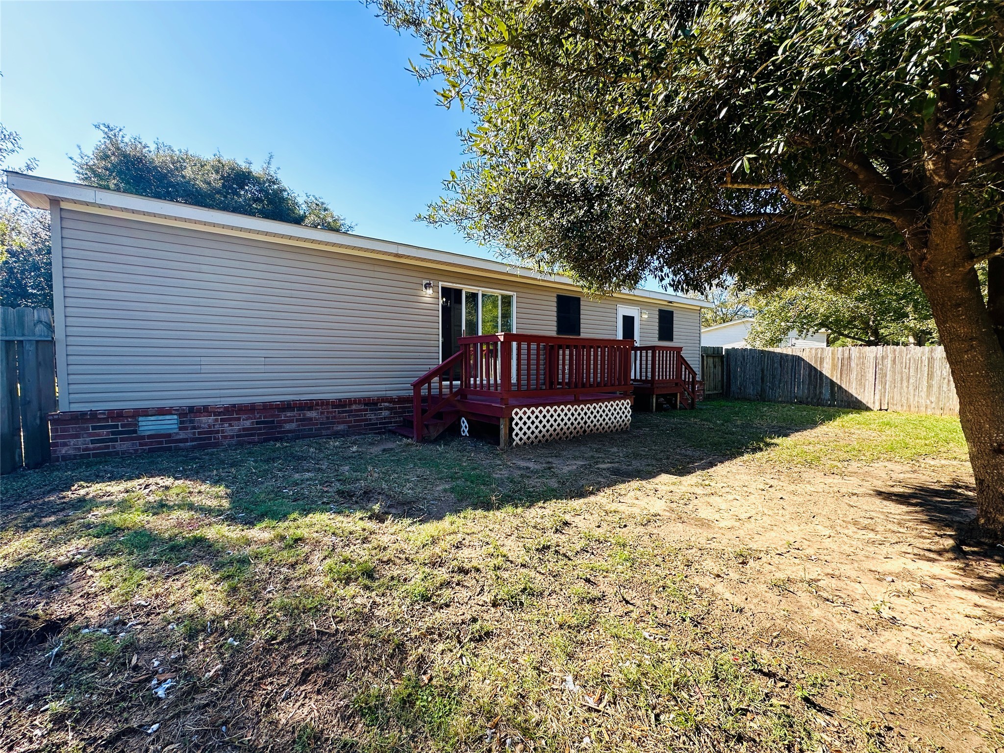 16497 Spring Rain Court Conroe, TX 77302 - Photo 18 of 18 a view of a house with a yard