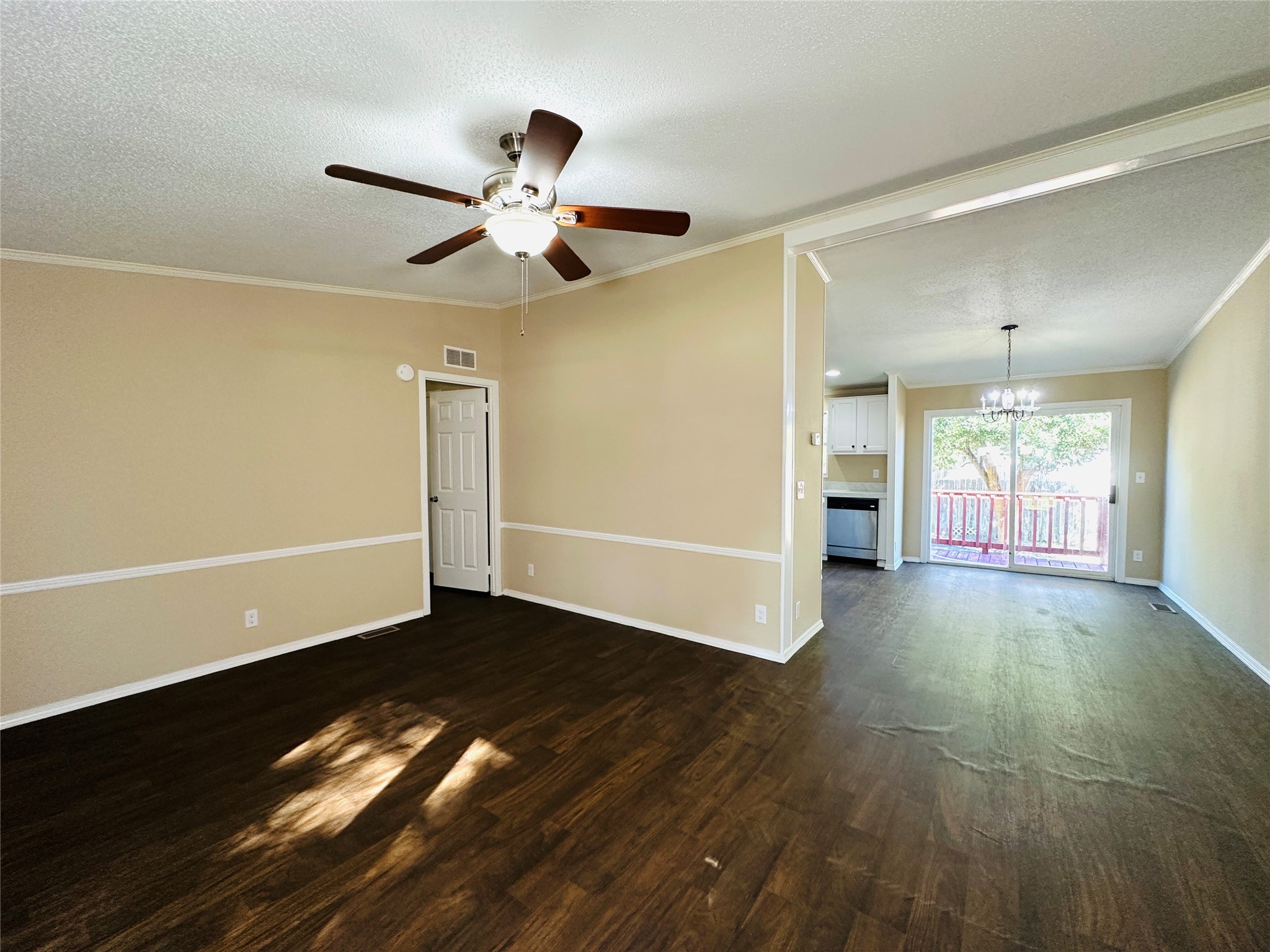 16497 Spring Rain Court Conroe, TX 77302 - Photo 2 of 18 a view of an empty room with wooden floor and a window