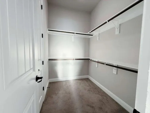 a view of a two chair and tables in the patio