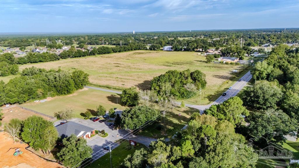 Woodbine Road Pace, FL 32571 - Photo 13 of 21 a view of a lake with outdoor space