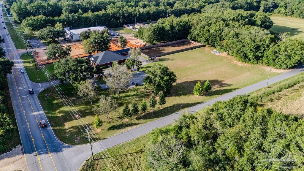 Woodbine Road Pace, FL 32571 - Photo 3 of 21 a view of a garden with an outdoor seating area