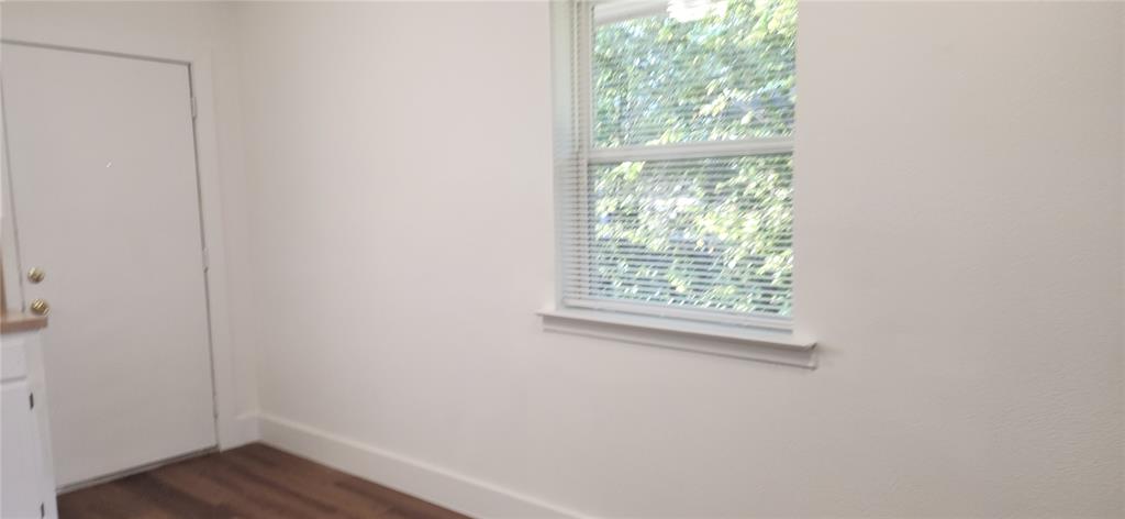 1029 Custer Road, Unit 1031 Richardson, TX 75080 - Photo 15 of 19 a view of a small space with wooden floor and a window