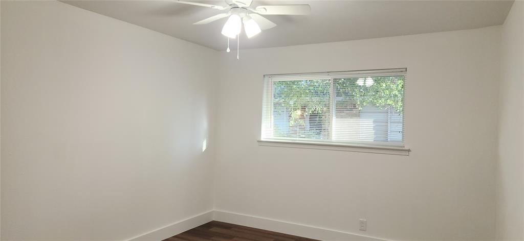 1029 Custer Road, Unit 1031 Richardson, TX 75080 - Photo 17 of 19 an empty room with a window