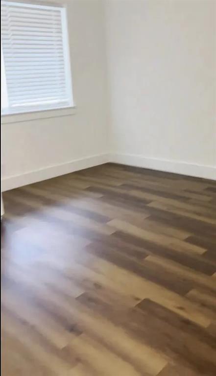 1029 Custer Road, Unit 1031 Richardson, TX 75080 - Photo 5 of 19 a view of a small space with wooden floor and a window