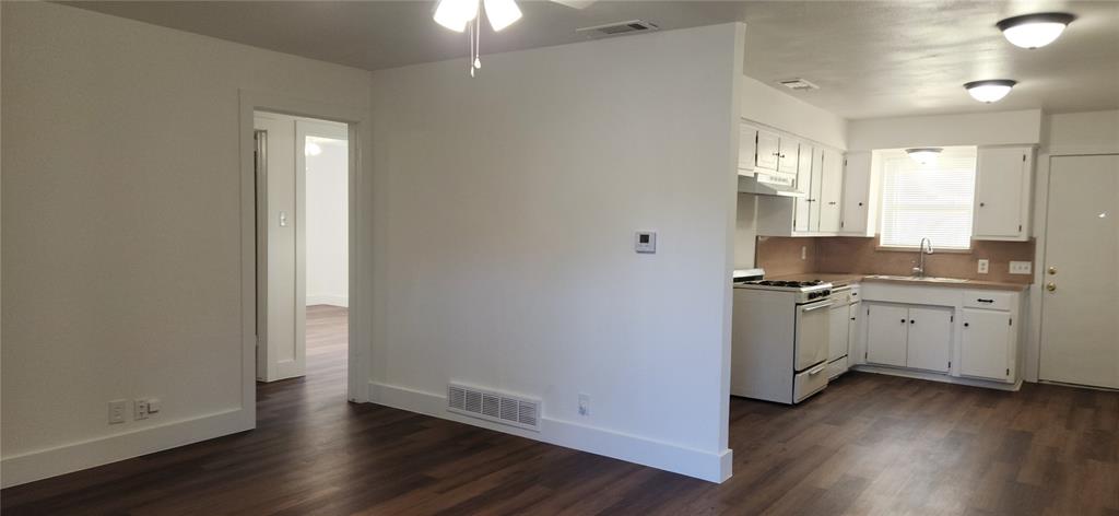 1029 Custer Road, Unit 1031 Richardson, TX 75080 - Photo 8 of 19 a view of a kitchen with refrigerator and window