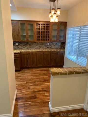a kitchen with stainless steel appliances granite countertop a stove and a refrigerator