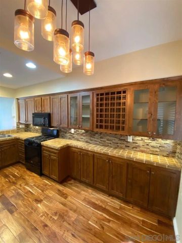 a view of a kitchen and a sink
