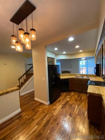 a kitchen with a refrigerator and a sink