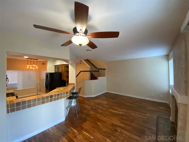 a view of kitchen with furniture and wooden floor