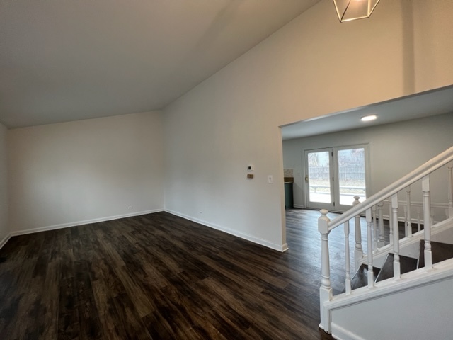 Undisclosed Address Naperville, IL 60565 - Photo 3 of 23 a view of an empty room and wooden floor